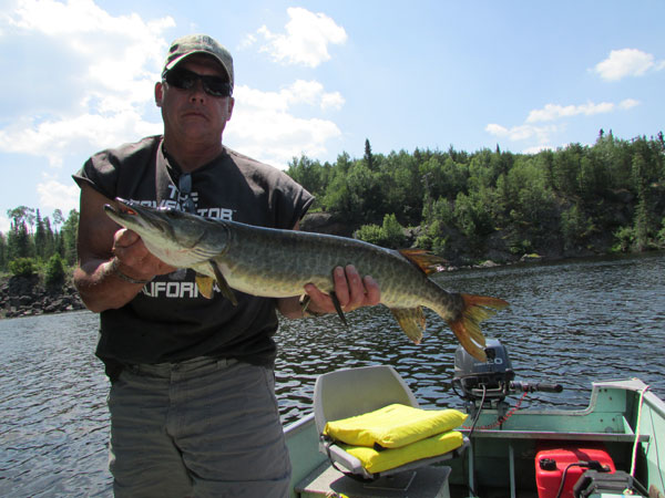 Dave P. with a Canadian Musky caught on a Big Mama.