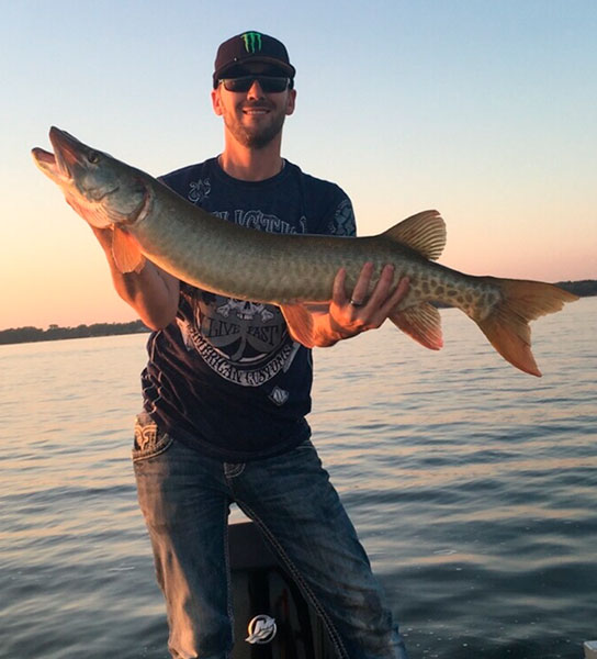 Brandon with another musky caught on a black-chartreuse MiniBoss.